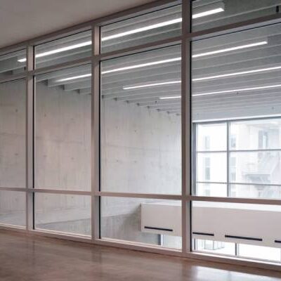 Fire-rated safety glass with aluminium frame for secure building interiors UK